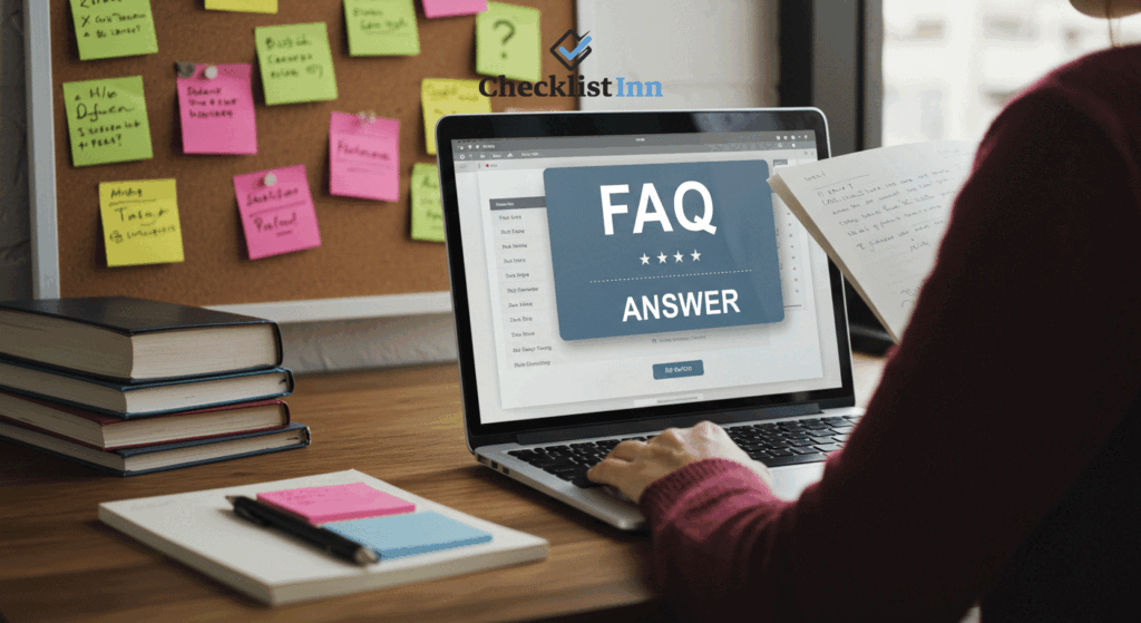A student reading answers to exam preparation questions on a laptop, with books and notes on the desk.