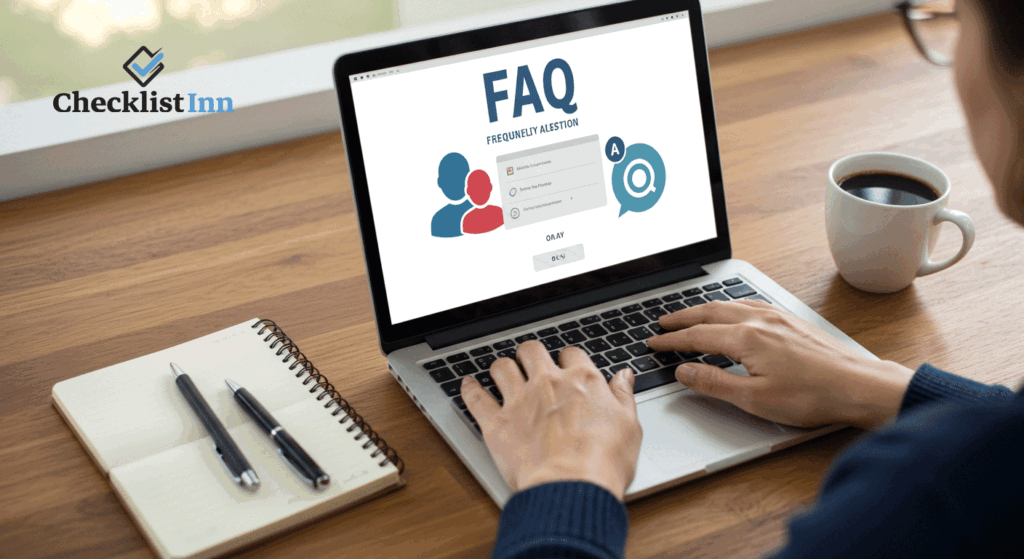 A person reading a FAQ section on a laptop with a notebook and coffee on the desk, representing frequently asked questions about savings checklists.