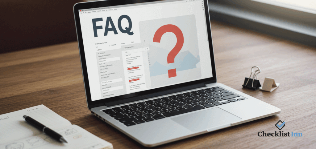 Open laptop on a clean desk showing an FAQ page with a notebook and pen, representing frequently asked questions about study schedules